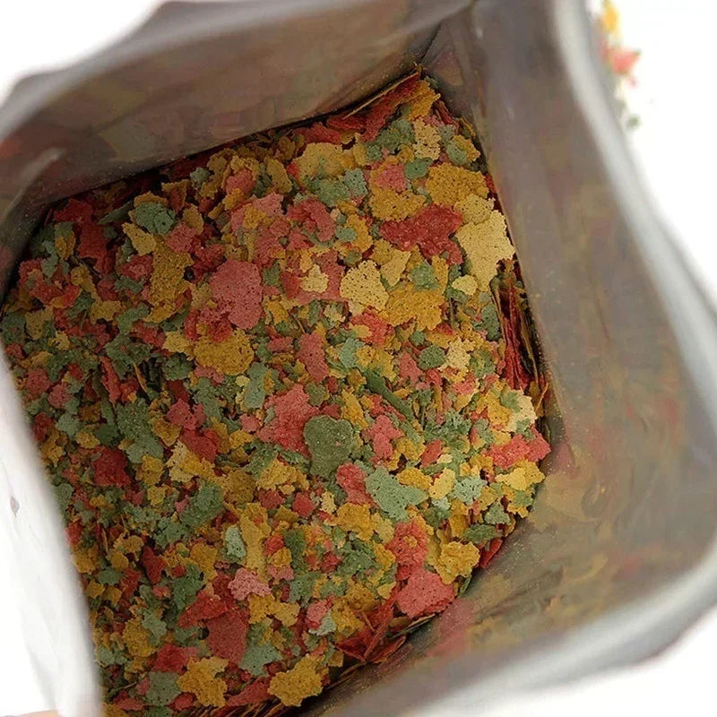 New 100g/pack Tropical Ornamental Fish Thin Slice Food Aquarium Fish Feed Fish Seedling Fattening Food Family Fishing Accessory